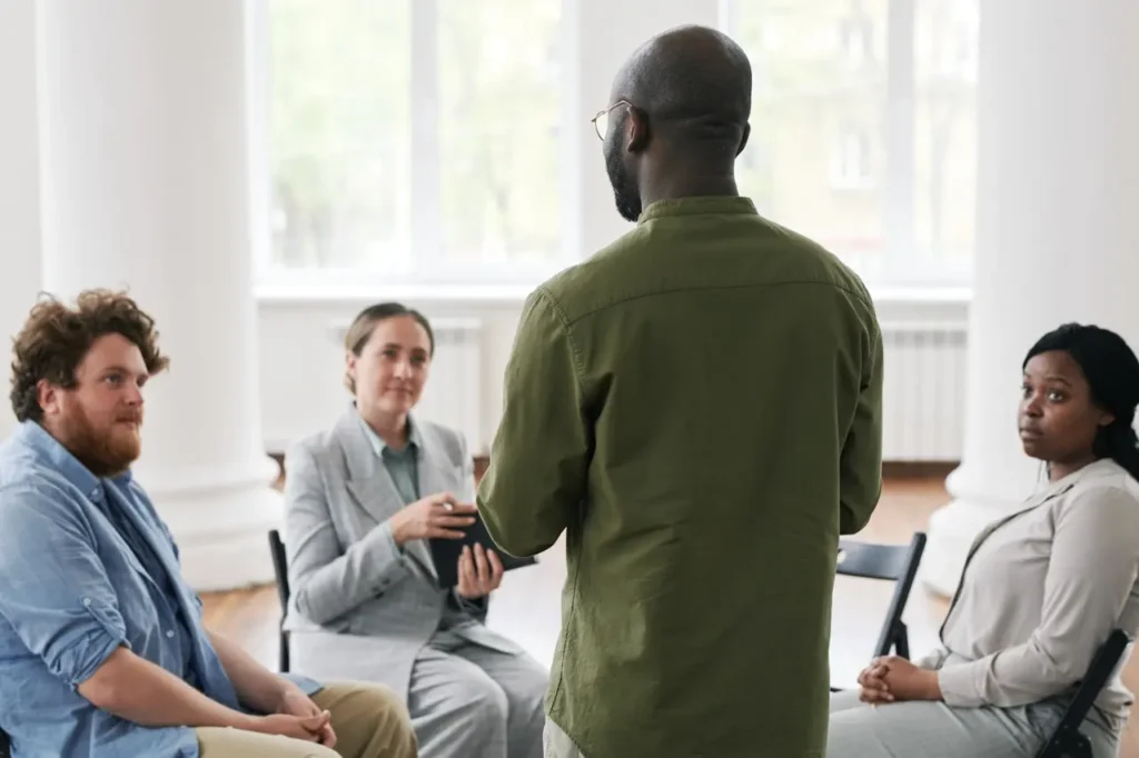 Therapist offering a group resources for families with mental illness​ orange county