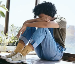 Woman who's body is releasing trauma and learning about the signs.