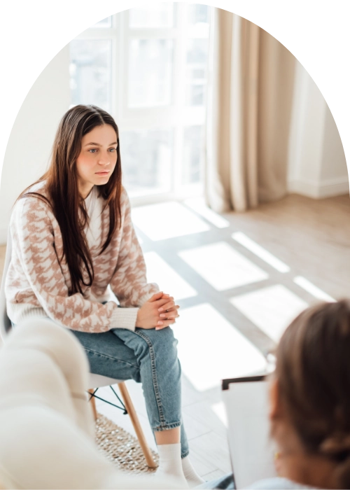 Woman in therapy receiving advanced mental health treatments.