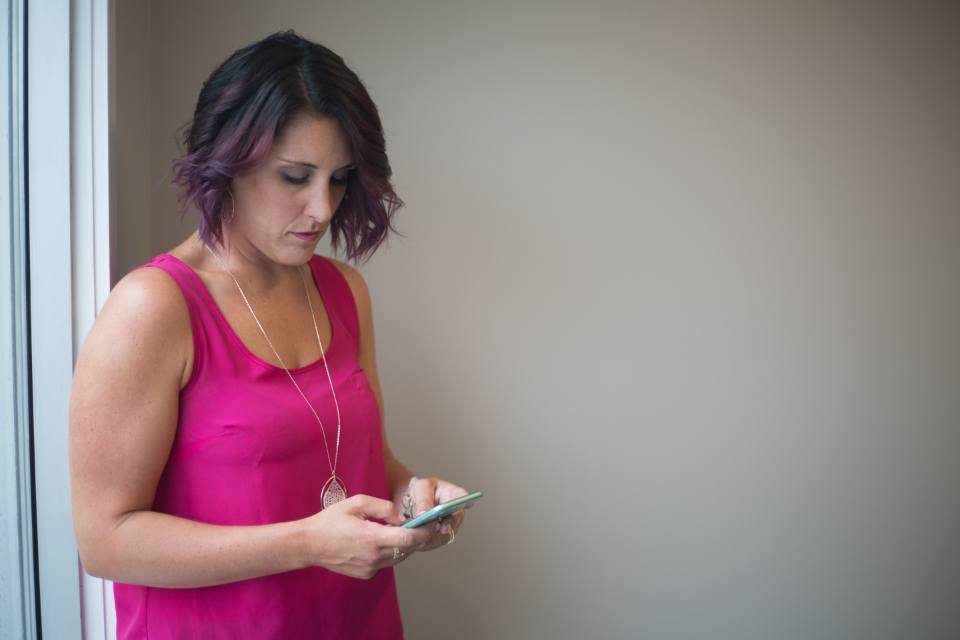 Woman looking intently at her phone